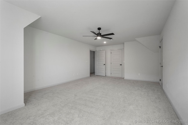 unfurnished bedroom featuring ceiling fan and light colored carpet