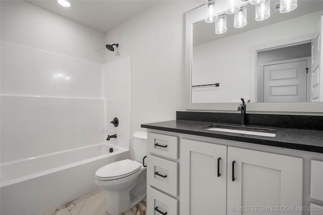 full bathroom featuring washtub / shower combination, vanity, and toilet