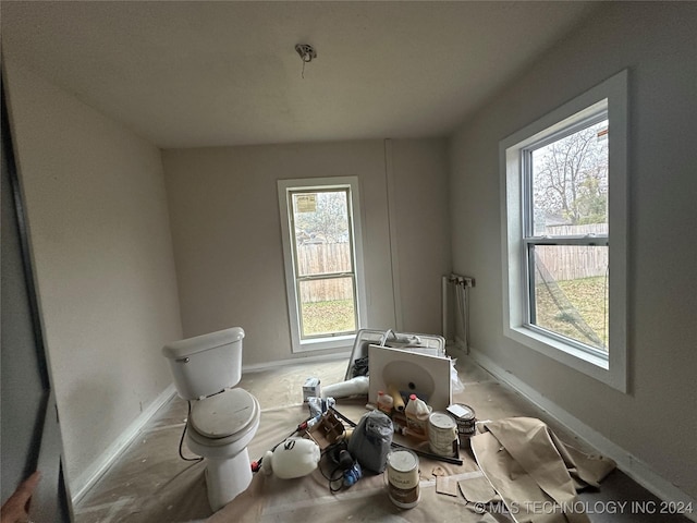 bathroom with toilet and radiator