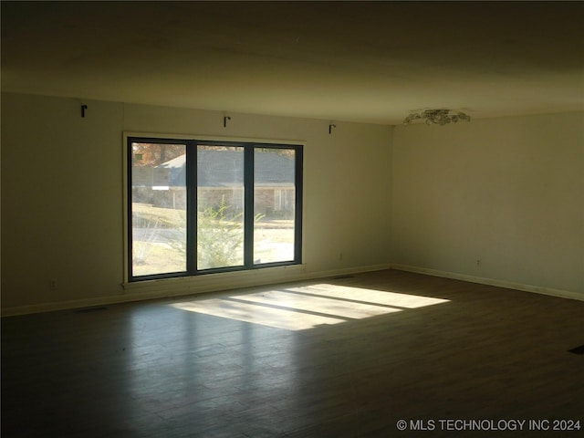 empty room featuring dark hardwood / wood-style floors