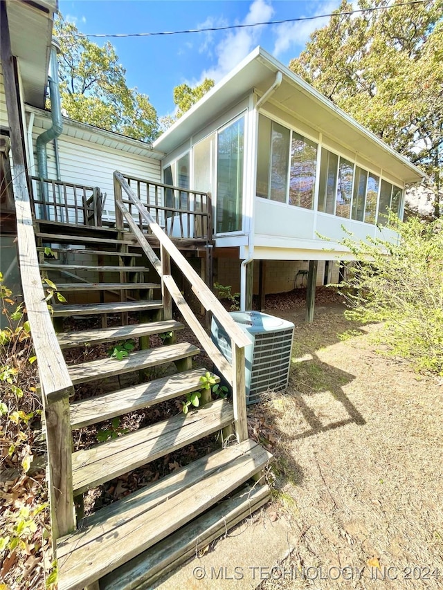 exterior space featuring a deck and central AC unit