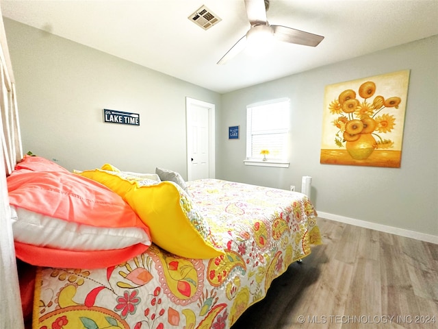 bedroom featuring ceiling fan and light hardwood / wood-style floors