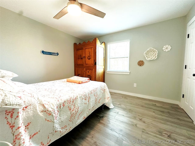 bedroom featuring ceiling fan and hardwood / wood-style flooring