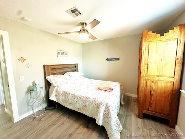 bedroom featuring ceiling fan and wood-type flooring