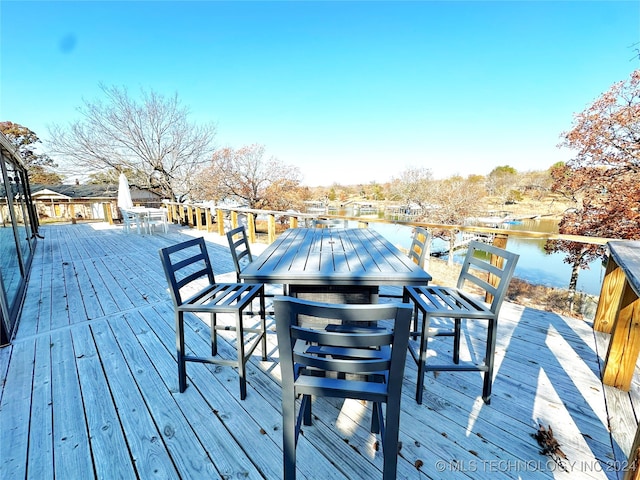 wooden terrace with a water view