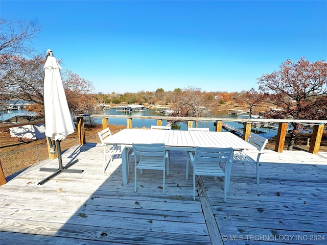 wooden terrace with a water view