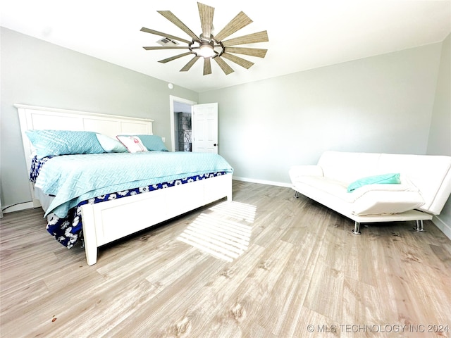 bedroom featuring ceiling fan and light hardwood / wood-style floors