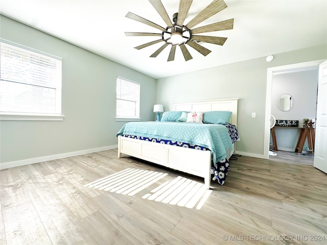 bedroom with ceiling fan and light wood-type flooring