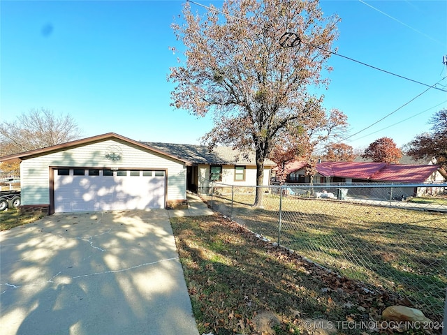 view of front facade with a garage and a front yard