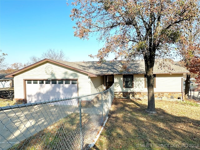 single story home featuring a front yard and a garage