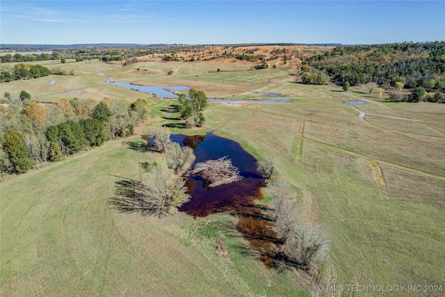 drone / aerial view with a rural view and a water view