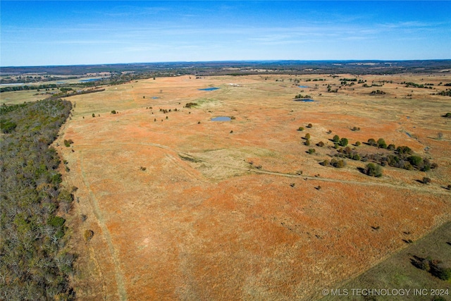 birds eye view of property with a rural view