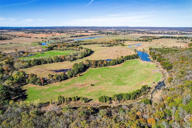 birds eye view of property with a water view and a rural view