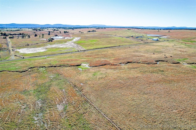 drone / aerial view with a mountain view and a rural view