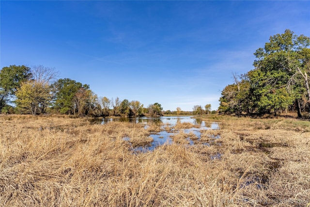 view of landscape featuring a water view