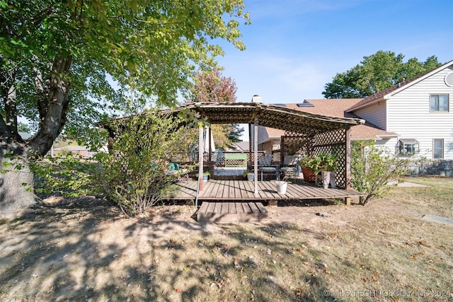 view of yard featuring a pergola and a wooden deck