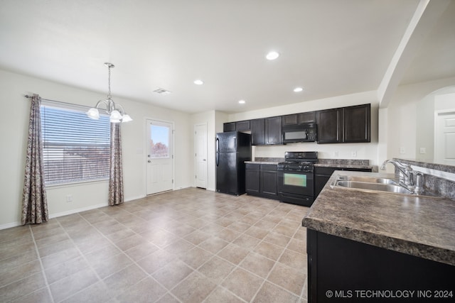 kitchen with dark brown cabinetry, sink, black appliances, pendant lighting, and an inviting chandelier