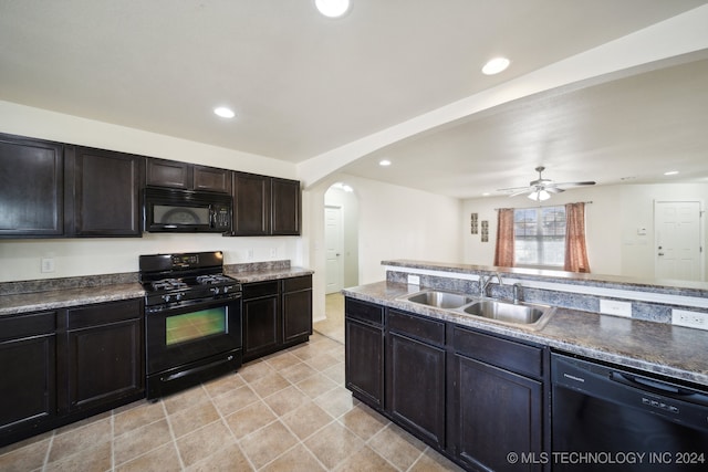 kitchen with dark brown cabinets, sink, ceiling fan, and black appliances