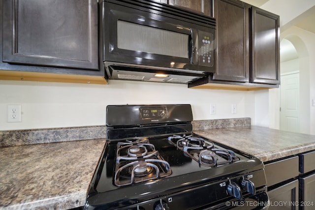 kitchen featuring dark brown cabinets and black appliances