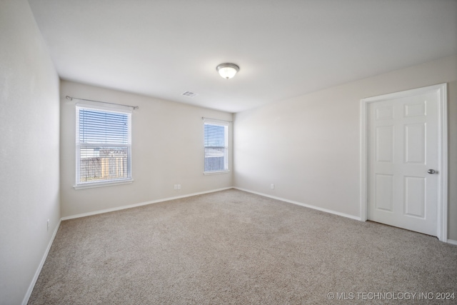 view of carpeted spare room