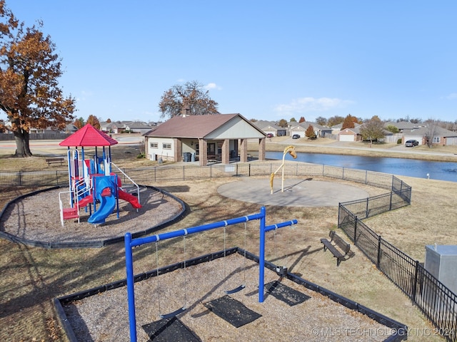 view of jungle gym with a water view