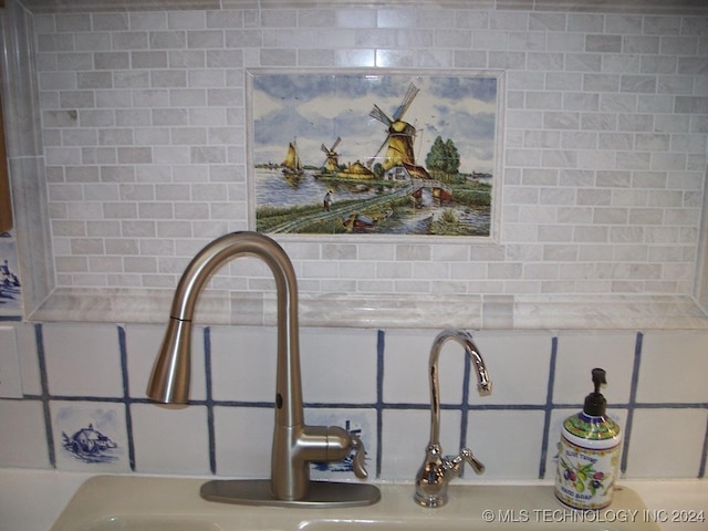 interior details featuring decorative backsplash and sink