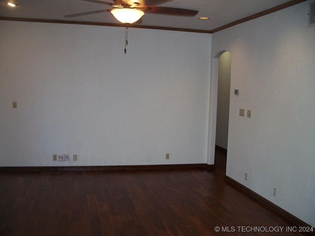 unfurnished room featuring ceiling fan, dark hardwood / wood-style floors, and ornamental molding