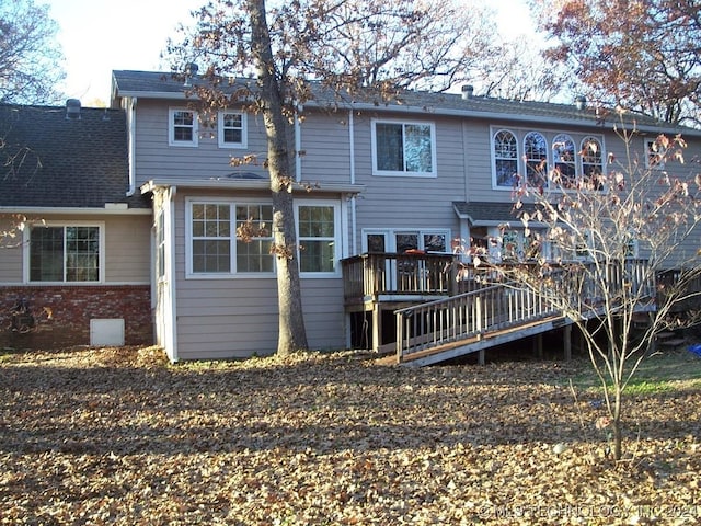 back of house featuring a wooden deck