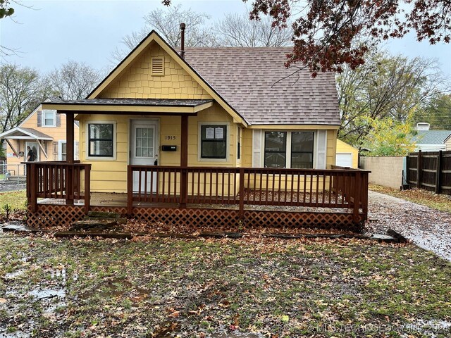1915 S Dewey Ave, Bartlesville, OK 74003 - rear view of house with roof with shingles and covered porch