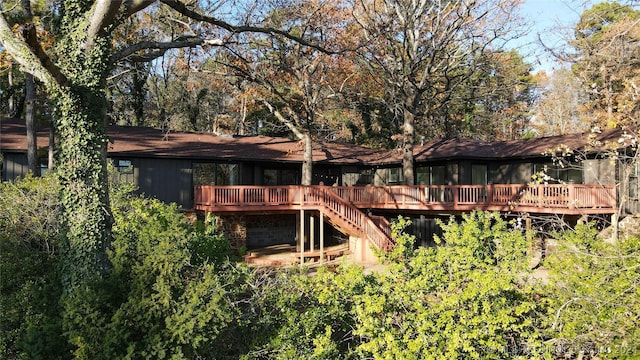 back of property featuring a wooden deck