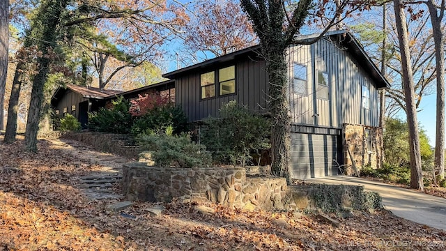 view of side of home with a garage