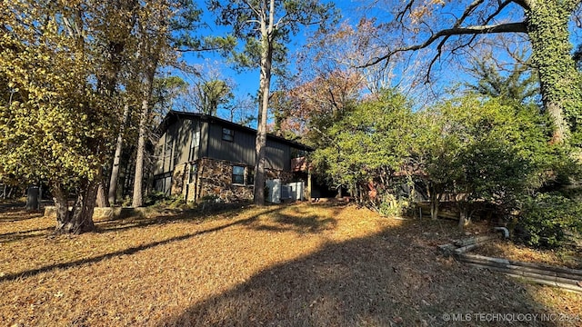 view of property exterior with a deck