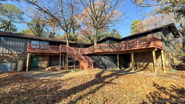 rear view of house with cooling unit, a patio area, and a deck