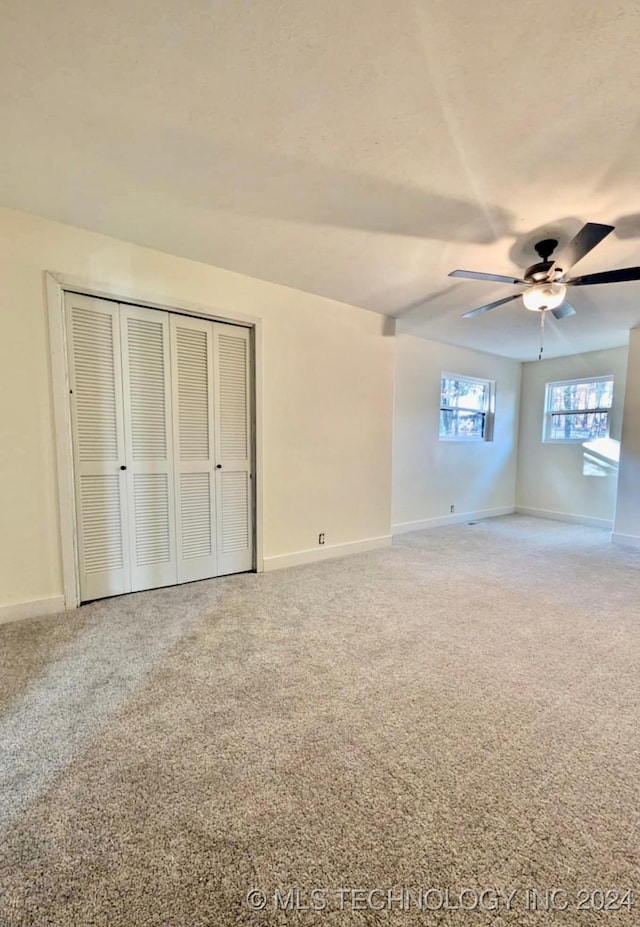 interior space featuring ceiling fan