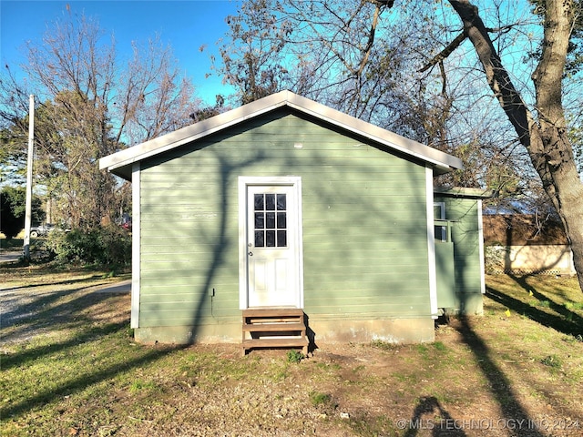 view of outdoor structure with a lawn