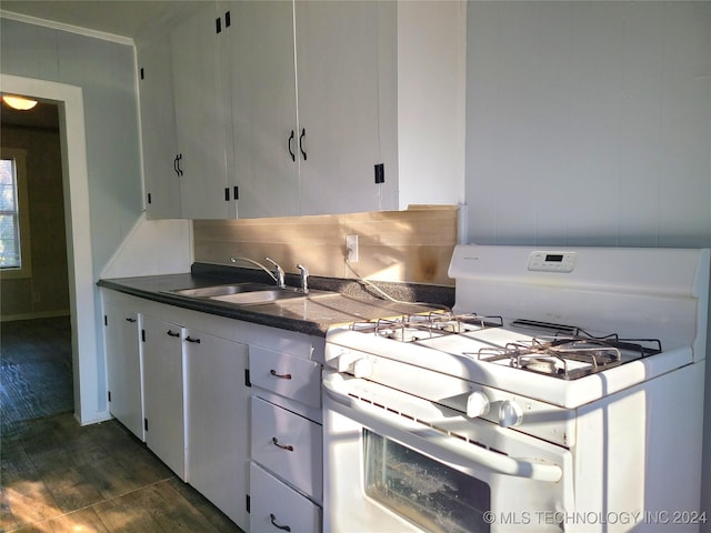 kitchen with white range with gas cooktop, white cabinetry, and sink