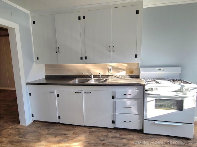 kitchen with white cabinetry, sink, white range with gas cooktop, and dark wood-type flooring