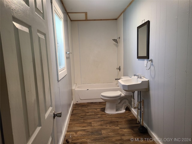 full bathroom featuring hardwood / wood-style flooring, wooden walls, toilet, and a wealth of natural light