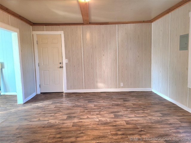 unfurnished room with electric panel, dark hardwood / wood-style flooring, and beamed ceiling