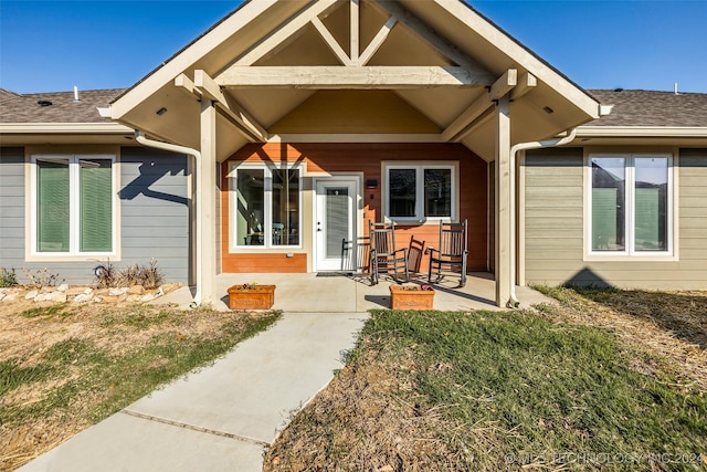 doorway to property featuring a yard