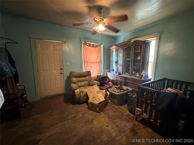 bedroom with ceiling fan and wood finished floors