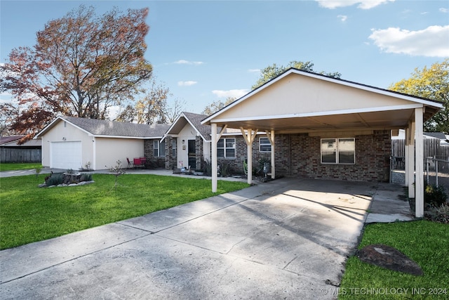 single story home with a carport, a garage, and a front lawn