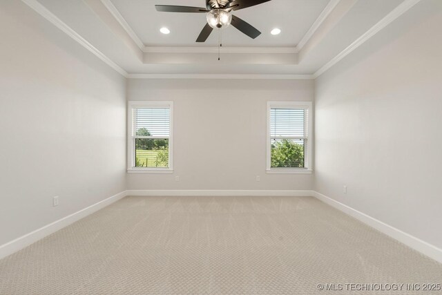 2601 W Twin Oaks St, Broken Arrow, OK 74012 - empty room featuring a raised ceiling, healthy amount of natural light, baseboards, crown molding, and recessed lighting