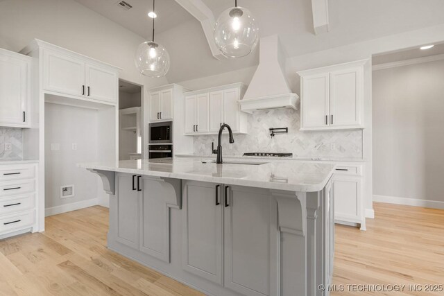 2601 W Twin Oaks St, Broken Arrow, OK 74012 - kitchen with custom exhaust hood, stainless steel appliances, white cabinets, and tasteful backsplash