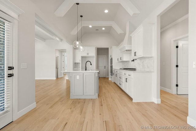 2601 W Twin Oaks St, Broken Arrow, OK 74012 - kitchen featuring white cabinets, baseboards, backsplash, light countertops, and vaulted ceiling