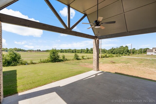 2601 W Twin Oaks St, Broken Arrow, OK 74012 - view of grassy yard featuring a ceiling fan, a patio, and a view of countryside