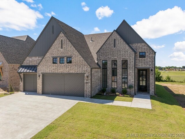 2601 W Twin Oaks St, Broken Arrow, OK 74012 - view of front of property with board and batten siding, a front lawn, concrete driveway, brick siding, and a shingled roof