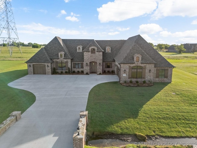 17413 S 52nd E Ave, Bixby, OK 74008 - french country style house with driveway, a garage, stone siding, and a front yard
