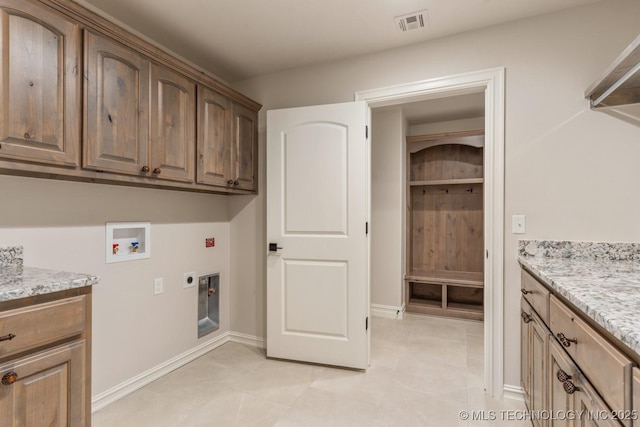 17413 S 52nd E Ave, Bixby, OK 74008 - laundry area featuring cabinet space, electric dryer hookup, hookup for a washing machine, light tile patterned flooring, and baseboards