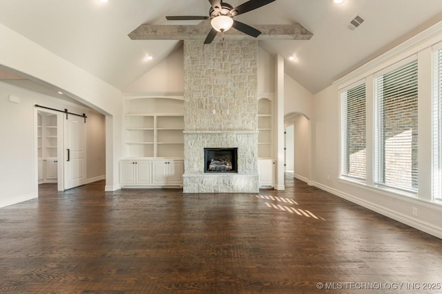 17413 S 52nd E Ave, Bixby, OK 74008 - unfurnished living room featuring baseboards, ceiling fan, a barn door, wood finished floors, and beamed ceiling